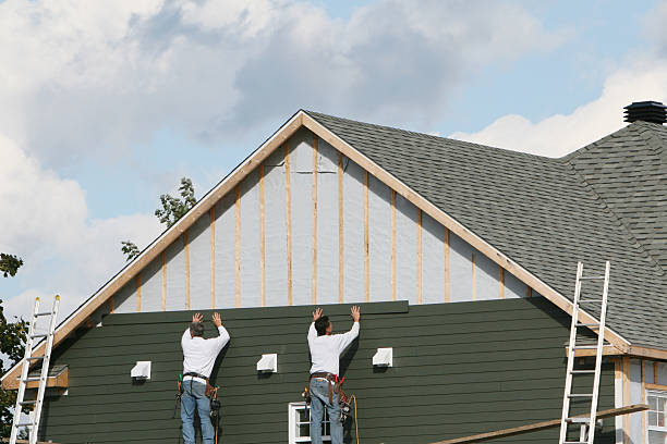 Professional Siding technician working in New Paris, IN
